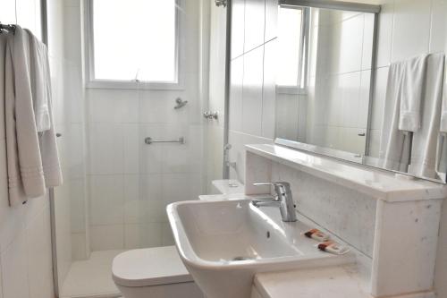 Ett badrum på Cordilheira Hotel