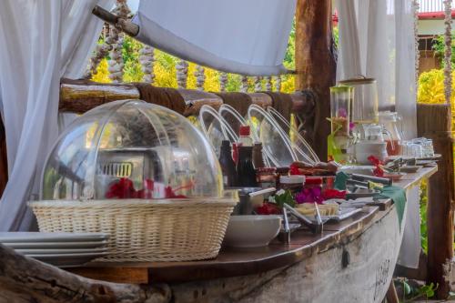 a table with food and a glass dome on it at TIANDE Boutique Hotel in Pwani Mchangani