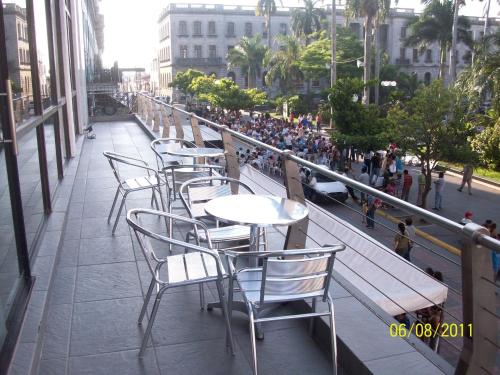 a row of tables and chairs on a balcony at Hotel Inglaterra in Tampico