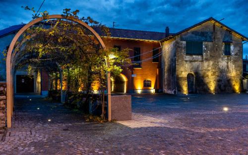 an archway in front of a building at night at La Torretta "I Gabbiani" sul Lago Maggiore in Maccagno Inferiore