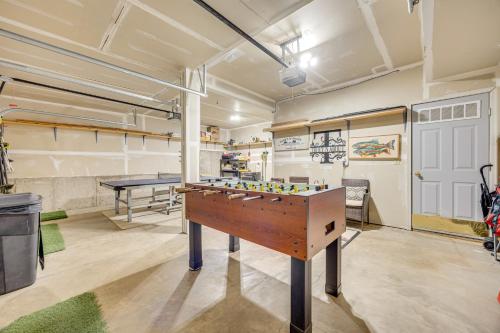 a room with a pool table and a ping pong table at Lakefront Divide Cabin with Game Room! in Woodland Park
