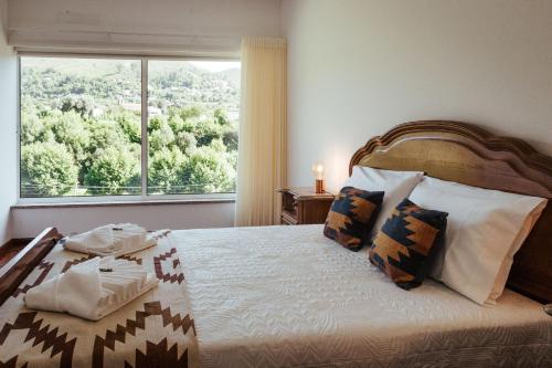 Postel nebo postele na pokoji v ubytování Quinta da Ponte by Gerês Casas