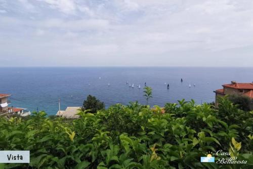 a view of the ocean with boats in the water at Casa Bellavista in Bergeggi
