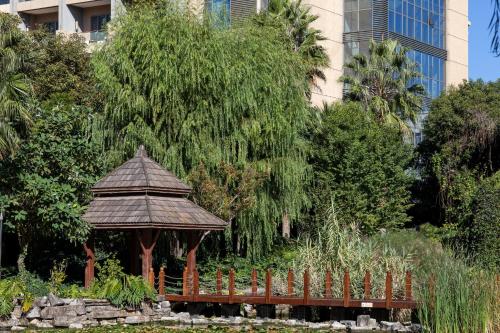 a gazebo in the middle of a garden at InterContinental Kunming by IHG in Kunming