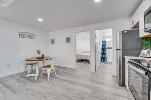 a kitchen and dining room with a table and chairs at Pet-Friendly Home Less Than 1 Mi to Downtown Moses Lake! in Moses Lake