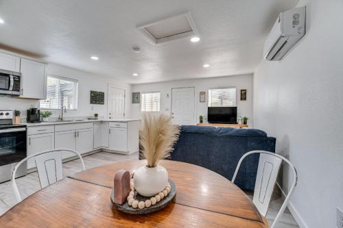 a kitchen and dining room with a table and a blue couch at Pet-Friendly Home Less Than 1 Mi to Downtown Moses Lake! in Moses Lake