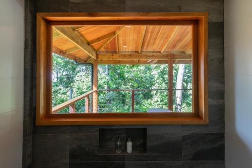 a bathroom with a window in a room at S Boutique Hotel in Bocas del Toro