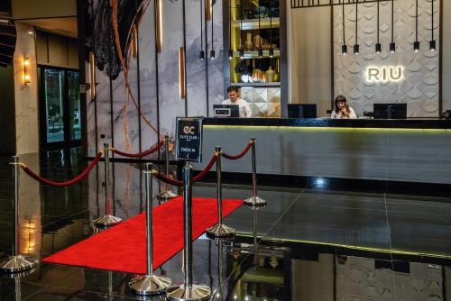 a red carpet on the floor of a hotel lobby at Riu Palace Kukulkan - Adults Only - All Inclusive in Cancún