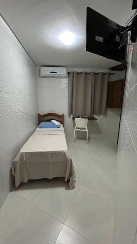 Ένα ή περισσότερα κρεβάτια σε δωμάτιο στο Paraíso Olindense