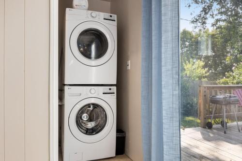 a washer and dryer in a room next to a window at Peaceful Park Living - 3BD 10mins to DT Peoria in North Pekin