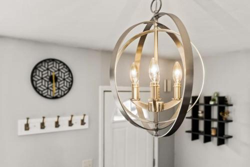 a chandelier hanging from a ceiling in a room at Cottage on Duryea - Cozy 1BD home in the Heights in Peoria Heights