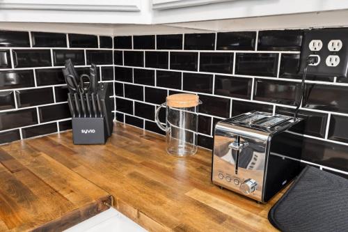 a counter with a toaster and a toaster on it at Suburban Sanctuary 3BD Perfect for Long Stays in Pekin