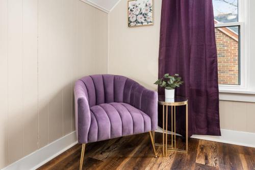 a purple chair in a room with a window at Tranquil 3 Bed Retreat Sleeps 7 in Peoria
