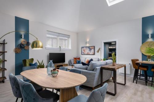 a living room with a couch and a table at City Centre Haven Apartment in Stirling