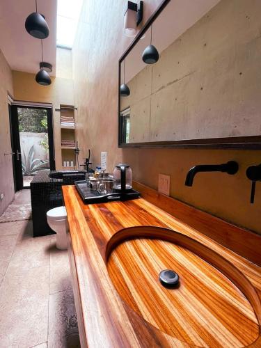 a kitchen with a wooden counter top in a room at Cuna del Cielo in San Miguel de Allende