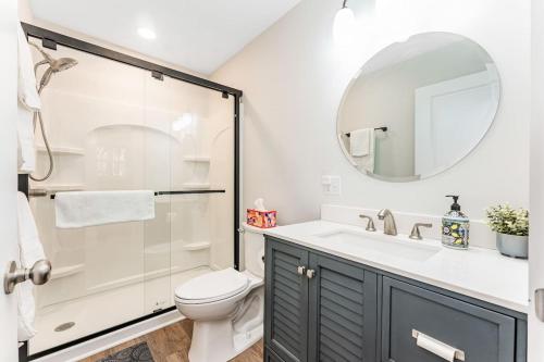 a bathroom with a shower and a toilet and a sink at Wintervue-beautiful home at Alpine Lake in Terra Alta
