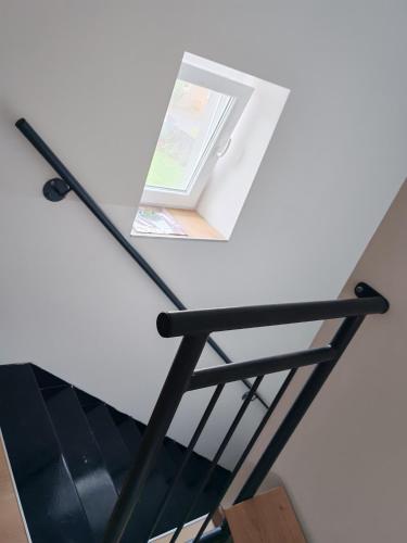 a glass table with a book on top of it at P&T Apartmán in Poprad