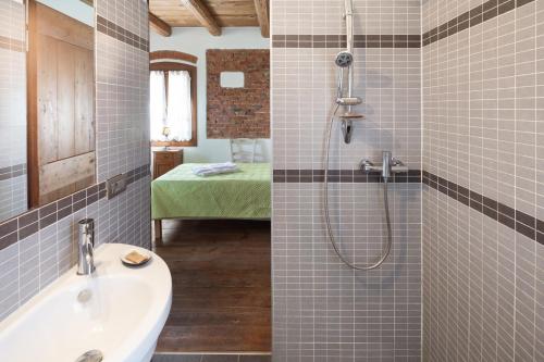 a bathroom with a sink and a shower at Locanda Ca'Vejo srl in Megliadino San Vitale
