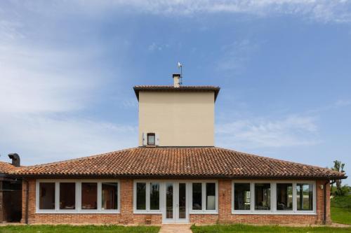 a building with a tower on top of it at Locanda Ca'Vejo srl in Megliadino San Vitale