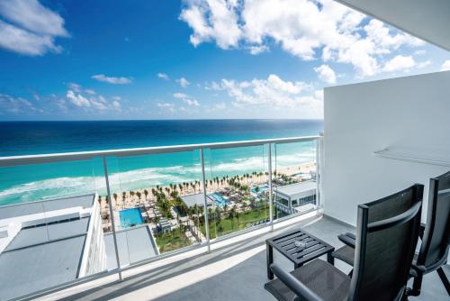 a balcony with a view of the ocean at Riu Palace Kukulkan - Adults Only - All Inclusive in Cancún