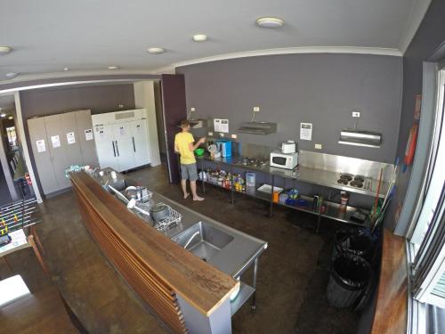 a kitchen with a sink and a counter top at Global Backpackers Port Douglas in Port Douglas