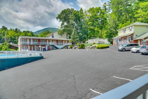 a parking lot in front of a building at Pinebrook - Three Bedroom House in Lake George