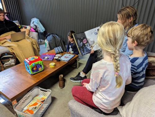 a group of children sitting around a table in a room at Roses Gap View in Dadswells Bridge