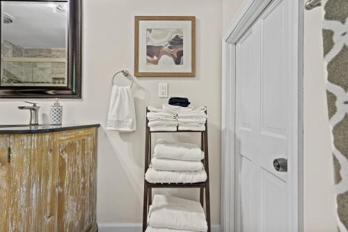 a bathroom with a towel rack next to a sink at Casa de Lorie the ultimate vacation home in Ooltewah