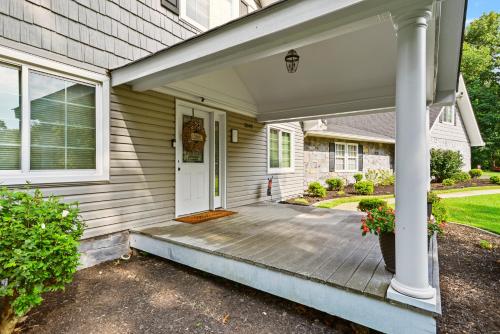 a front porch of a house with a white door at Casa de Lorie the ultimate vacation home in Ooltewah