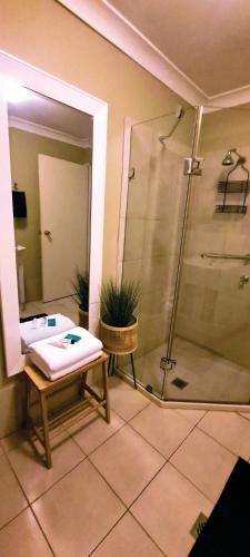 a bathroom with a shower and a sink at The Hunter Valley Star Gazing BubbleHotel in Mulbring