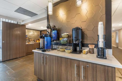 a kitchen with a coffee maker on a counter at Best Western Plus Laurel in Laurel