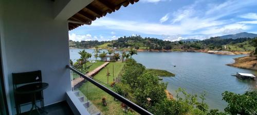 a view of a river from a balcony at Jordan Hotel Boutique in Guatapé