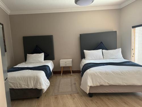 Ένα ή περισσότερα κρεβάτια σε δωμάτιο στο Annies Place Self Catering