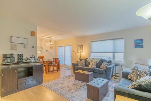 a living room with a couch and a table at The Westside Garay Townhome in Fairbanks