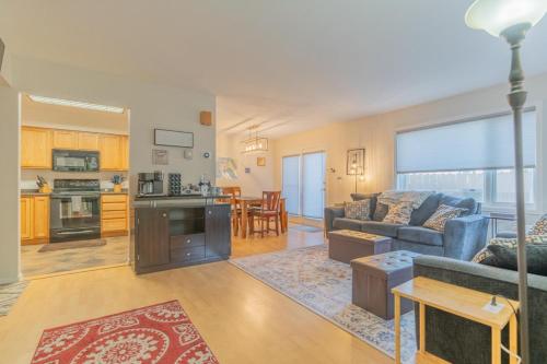 a living room with a couch and a table at The Westside Garay Townhome in Fairbanks