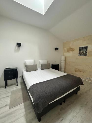 Ένα ή περισσότερα κρεβάτια σε δωμάτιο στο Aquitain Home chambre studio appartement Gare Saint Jean