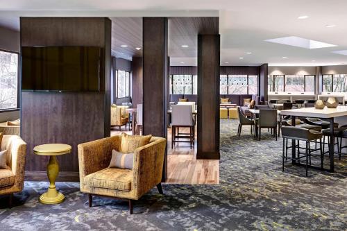 a lobby of a hotel with chairs and tables at Portland Marriott Downtown Waterfront in Portland