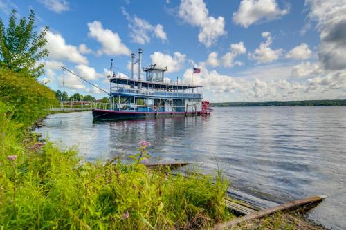 a large boat is docked on the water at Walk to Chautauqua Lake Mayville Getaway! in Mayville