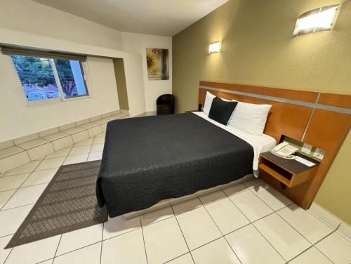 Postel nebo postele na pokoji v ubytování Hotel Interforum