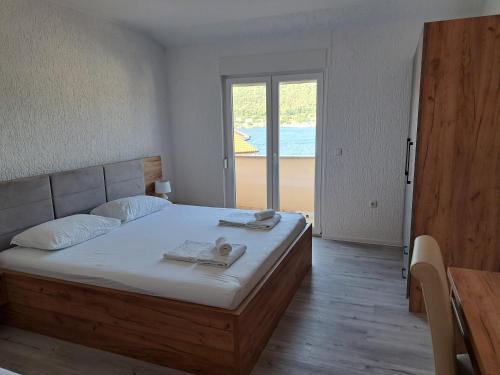 Postel nebo postele na pokoji v ubytování Apartments Vili