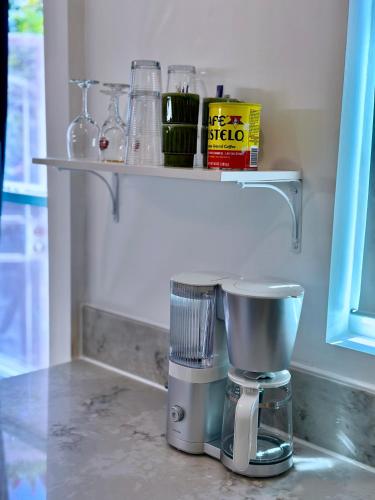 a coffee maker sitting on a counter in a kitchen at Modern, Remodeled Echo Park House-Walk to Sunset Blvd, Dodgers Stadium, Shops, Bars, Restaurants, Lake, Concerts in Los Angeles