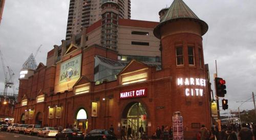 a large red brick building with a market center at Double Room - Quaint Spot in Marayong - Centrally Located - Shared Bathroom in Blacktown
