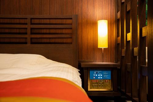 Postel nebo postele na pokoji v ubytování HOTEL LOTUS Superior RESORT NRT