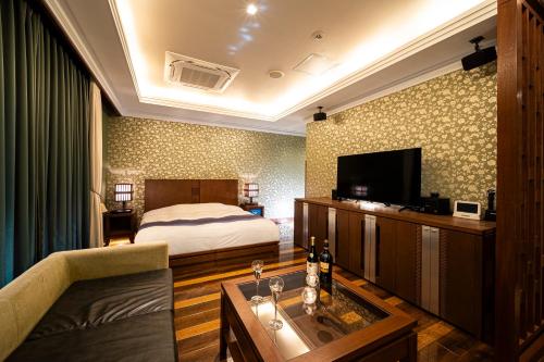 TV a/nebo společenská místnost v ubytování HOTEL LOTUS Superior RESORT NRT