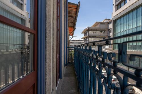 a balcony with a view of a city at Habitatio - Aliados by LuxiStay in Porto