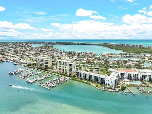 an aerial view of a harbor with boats in the water at Heated 2 Bath Waterfront Upscale Condo in Marco Island