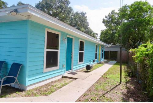 a blue house with a blue house at Nataj suites at Tampa in Tampa
