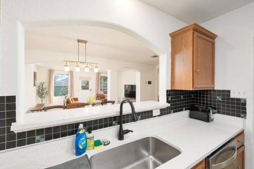 a kitchen with a sink and a counter top at Spacious 4BR w Game Room - 15 min to Seaworld in San Antonio