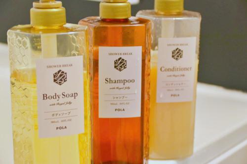 three bottles of essential oils sitting on a shelf at familie in Otsu