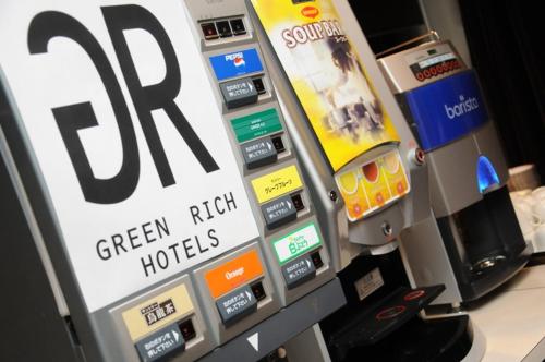 a close up of a sony green rich houses ticket machine at Oita Regal Hotel in Oita
